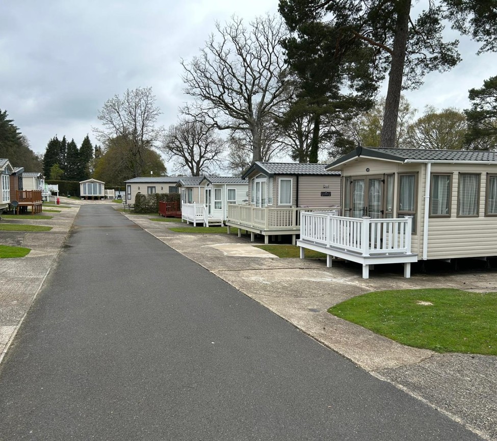 a image of a road with static caravans to the side